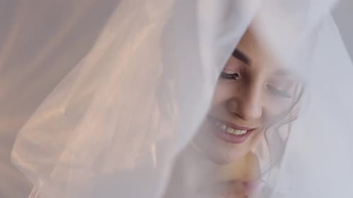 Smiling Bride Wearing Veil Close Up