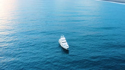 Aerial View of White Yacht Sailing on Ocean