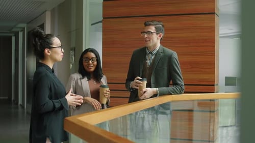 Multiethnic Colleagues Chatting over Coffee