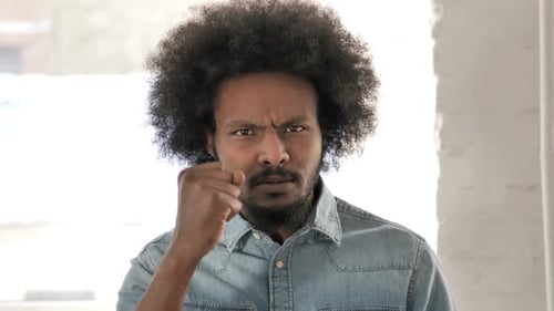 Stern Man Pointing Finger in Direct Communication