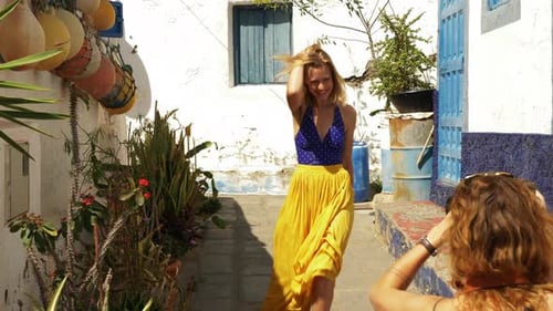 Blonde Woman Posing in a Colorful Urban Alley