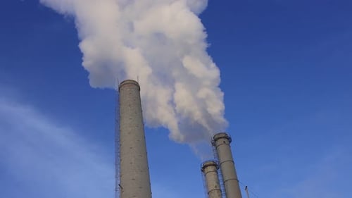 Smoke from the chimneys.