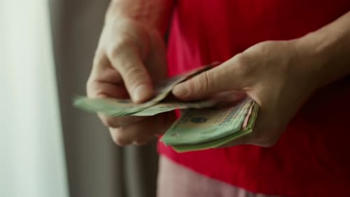 Man Counts Money