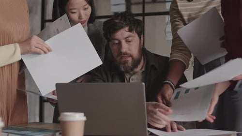 Caucasian Businessman Overwhelmed by Paperwork