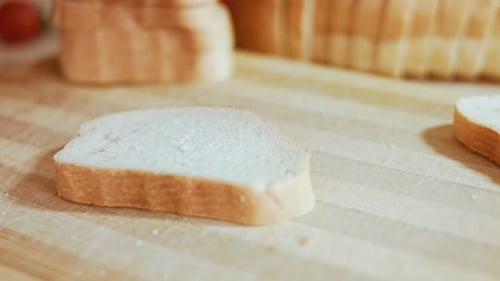 Sliced White Bread on a Wooden Cutting Board