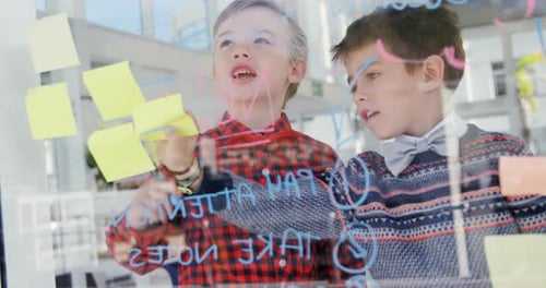 Children Brainstorming Ideas at Glass Whiteboard