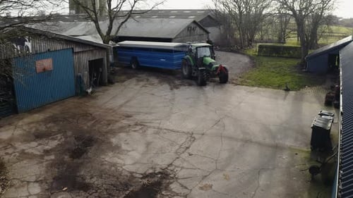 Drone Flight Over Tractor Pulling Trailer