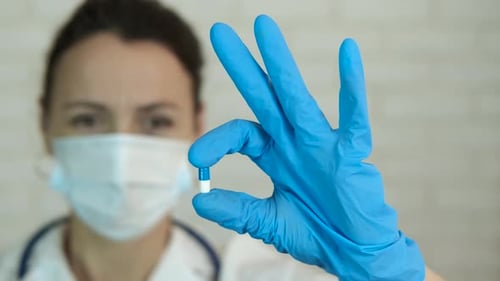 Therapist Holding Medicine Capsule