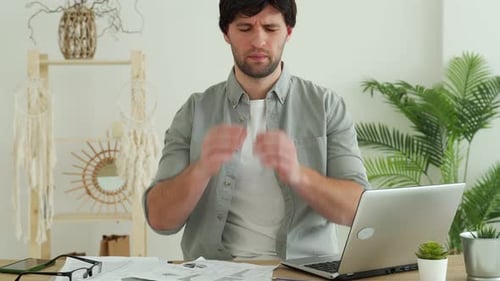 Man Experiences Difficulties Due to Fatigue While Working in Office