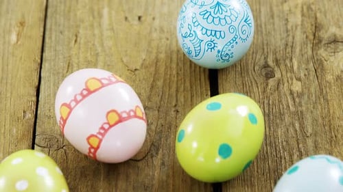 Colorful Painted Easter Eggs on Rustic Wooden Table