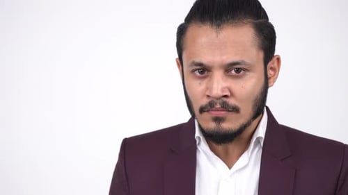 Man in Suit Poses in Studio Close Up