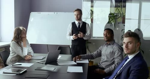 Team Meeting at Conference Table in Office