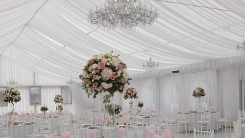 Elegant Event Space with Tables and Chandeliers