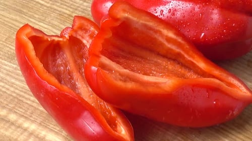 Vibrant Red Bell Peppers on Wood Surface