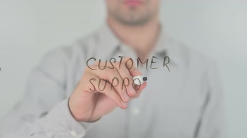 Man Writes Customer Support on Clear Surface