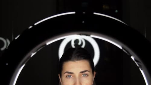 Woman With Glasses In Front Of Ring Light