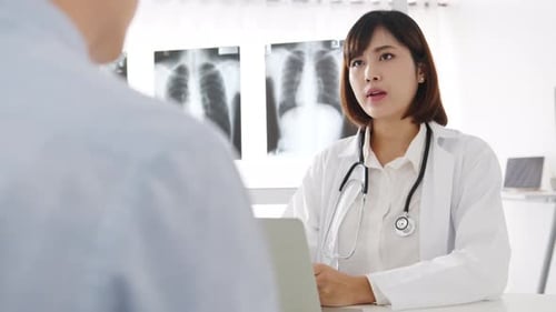 Doctor Consults with Patient in Bright Modern Office