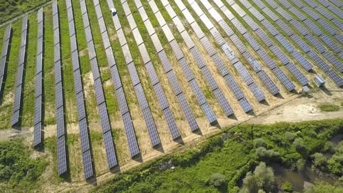 Aerial view of solar power plant field. Electrical photovoltaic panels for producing clean ecologic