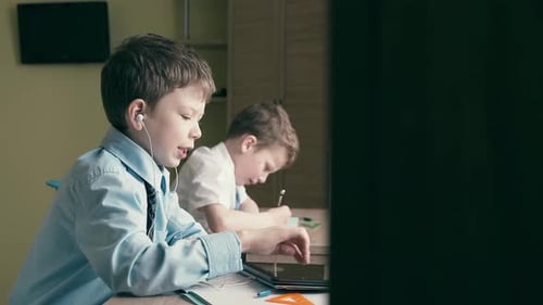 Boys Studying at Desks at Home