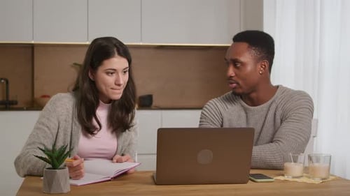 African American Tutor is Helping Caucasian Woman Student to Prepare to Pass Exam Learning at Home
