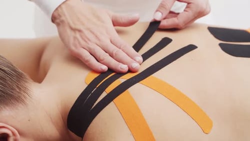 Medical Taping Application on Person's Back