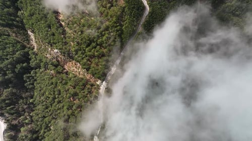 Foggy road in the mountains aerial view 4 K
