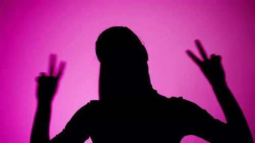 Silhouette with Peace Sign on Pink Background