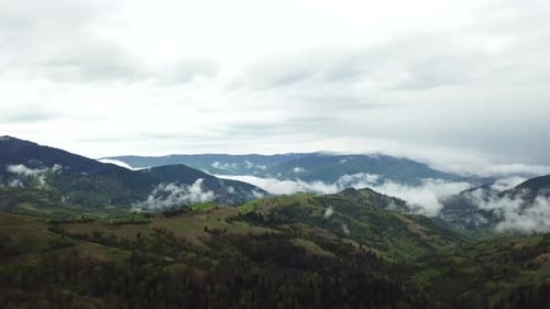 Aerial View of Mountain Range with Clouds
