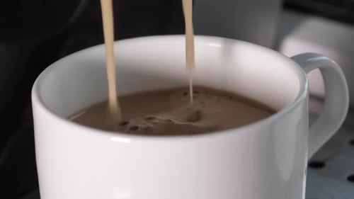 Coffee Being Poured Into White Mug, Close Up