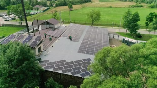 Solar Panel Installation on Building Roof Aerial View