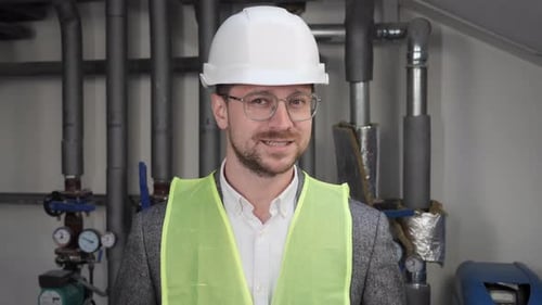 Smiling Male Face Architect in Eyeglasses Standing Near Water Supply Systems