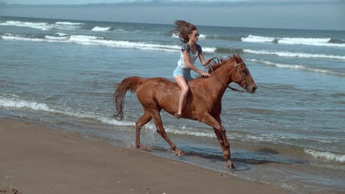 Super slow motion shot of woman riding horses at beach, Oregon, shot on Phantom Flex 4K