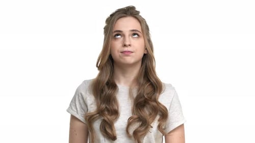 Woman Looking at Camera in Studio, Brightly Lit