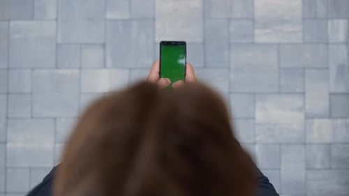 Man in Suit Uses Green Screen Phone Outdoors