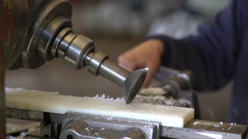 Milling Machine Carves a Plastic Piece