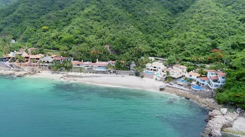 Aerial View of Luxury Villas along Tropical Beach