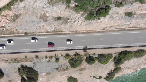 Beautiful coastline with single speed highway and cars riding fast