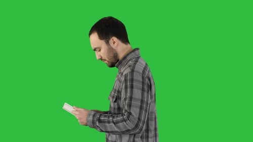 Tablet computer Side view of man using digital tablet on