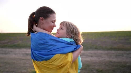 Ukrainian Family Loving Smiling Son Hugs Mom Tightly