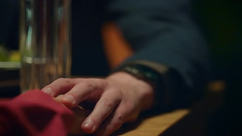 Supporting Couple Holding Hands on Romantic Dinner Date at Restaurant Table