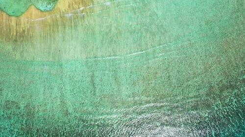 Aerial drone shot seascape of luxury tourist beach time by shallow ocean and bright sand background