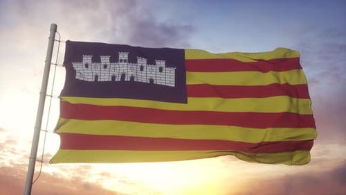 Realistic Ibiza Flag Waving Against a Sunset Sky