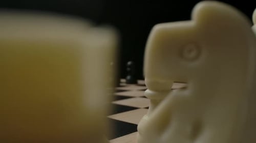 Dramatic Chess Pieces on Chessboard with Low Angle