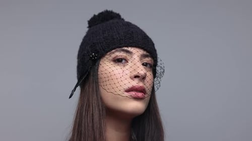 Woman in Stylish Knit Hat with Veil