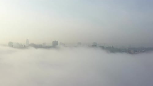 Aerial View of the City in the Fog.