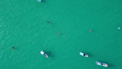 Various Empty Fishing Boats Drifting on the Sea, Drone View.