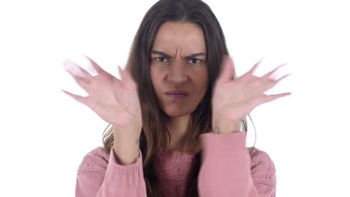 Woman Expressing Disagreement with Hand Gesture on White