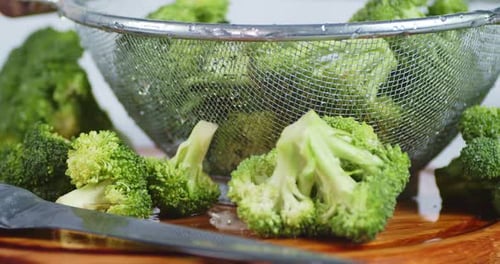 Fresh Washed Broccoli on Cutting Board Close Up
