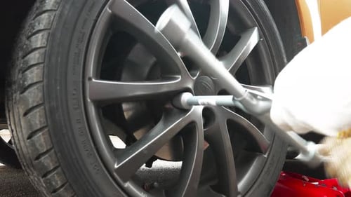 Close Up of Car Wheel Being Serviced