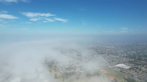 Aerial View of a City Neighborhood with Clouds